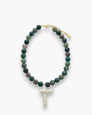 Faye Necklace with moss agate stones and large cross pearl on a white background