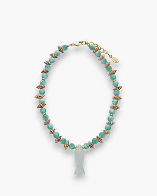 Jessie Necklace with moonstone, spotted shells, and crystal quartz fish pendant on a white background.