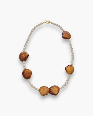 Kitts Necklace with pearls and natural shell accents on a white background