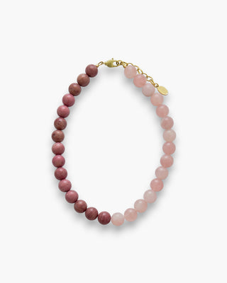 Lucy Necklace with rhodonite and Madagascar rose quartz beads on a white background.
