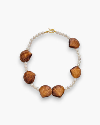 Mini Kitts Necklace with pearls and natural shell accents on a white background