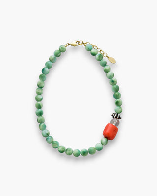Monroe Necklace with moonstone, coral, and zebra shell on a white background