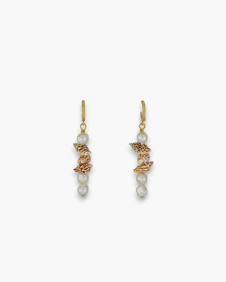Sierra Earrings with spotted shells and pearl-accented gold hoops on a white background