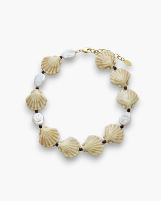Simi Necklace with ceramic shells and freshwater pearls on a white background