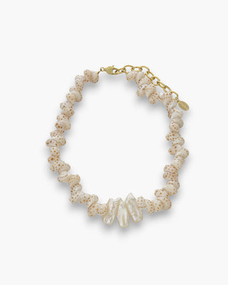 Stella Necklace with tiger snail shells and Biwa stick pearls on a white background